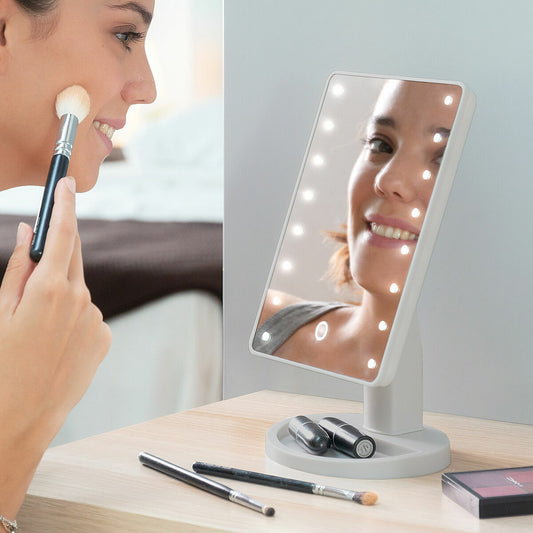 Miroir de table avec éclairage LED tactile pour maquillage et soin du visage.